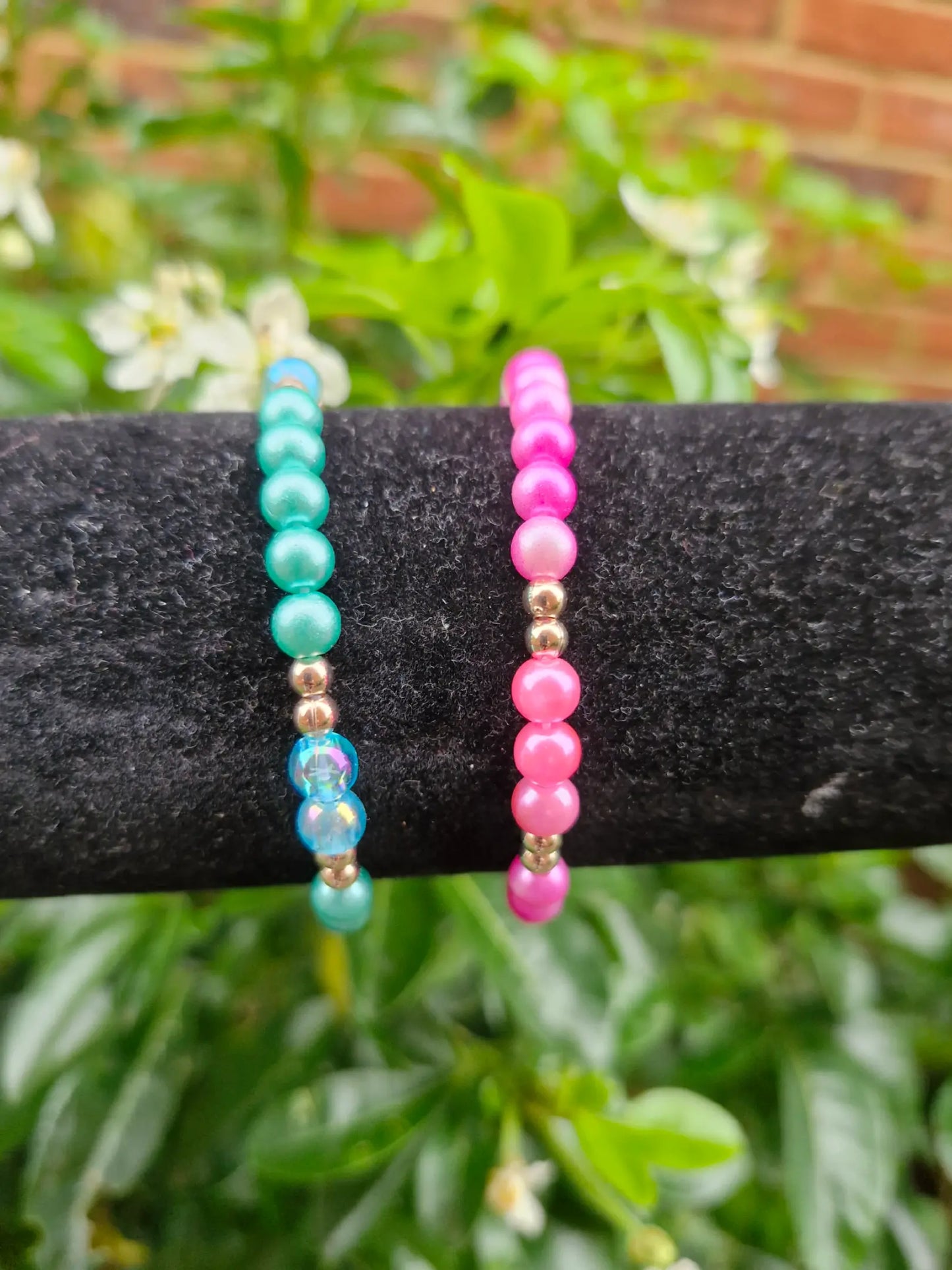 pink , blue pearl bracelets